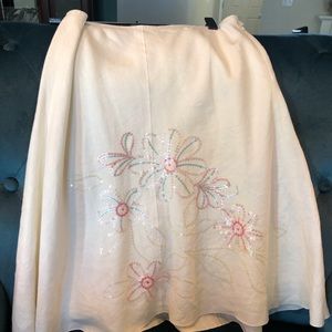 White skirt with sequence.